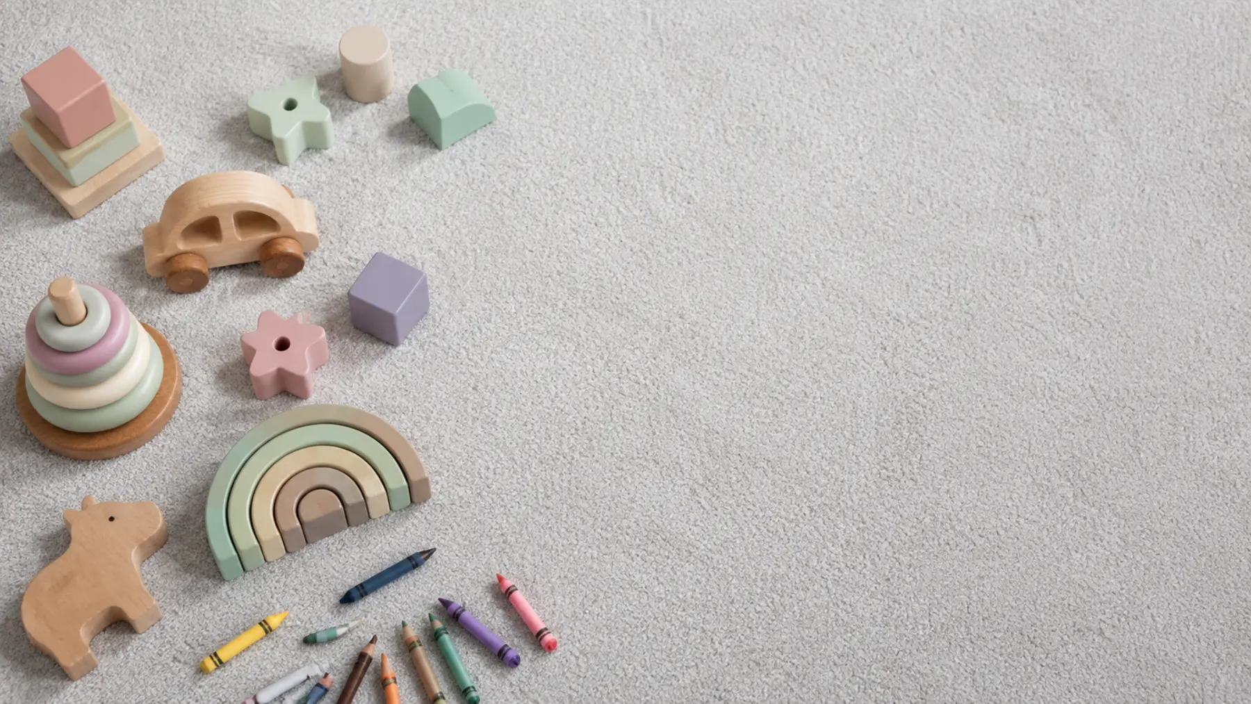 Safe, creative toys arranged on a soft carpet